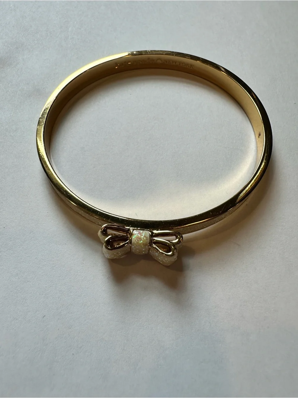 Kate Spade Gold Bow Bangle Bracelet with Iridescent Cream Inlay